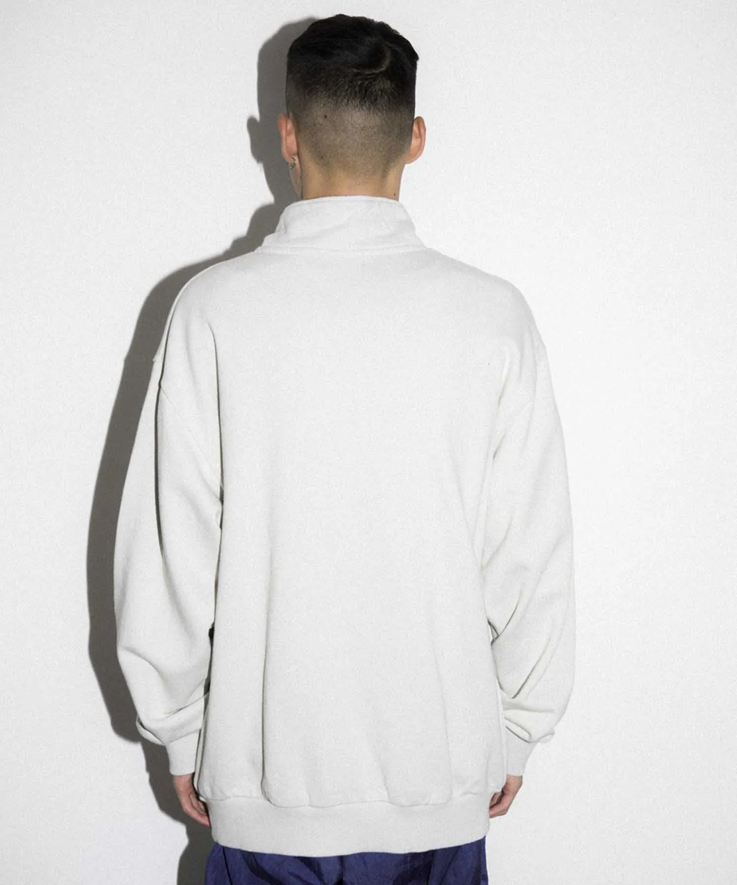 EMBROIDERY LASER HALF ZIP SWEAT